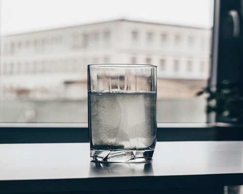 Clean water glass on table